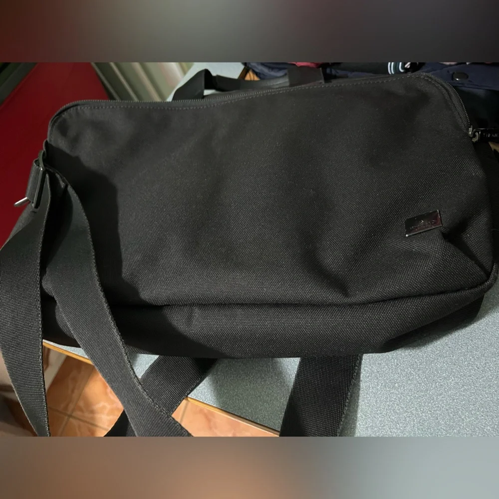 KNOMO Black Unisex Laptop Briefcase Messenger Bag with many compartments.